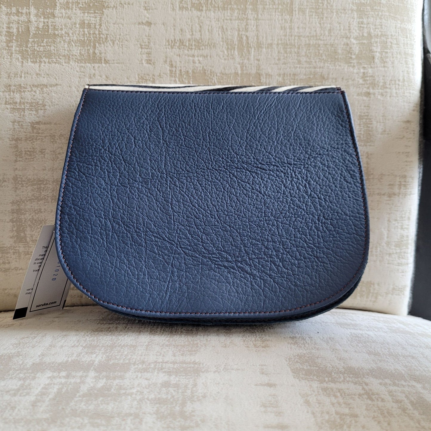 Sac Lena Soruka en Croûte de Cuir : Imprimé animalier, Pompon Coloré & Multi-Soufflets